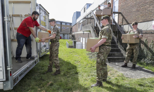 Scots guardsman assisting in helping move records at St Mary's Hospital to make space for the outbreak of covid-19.