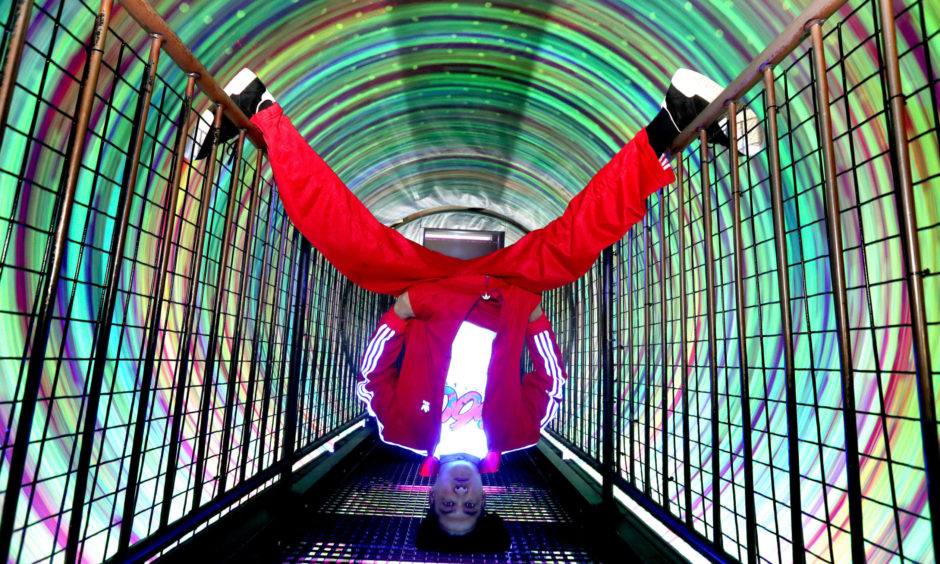 Breakdancer B-Boy Leerok from 360 Allstar performed some basketball tricks in the bright lights of the whirling Vortex Tunnel at Camera Obscura World of Illusions.