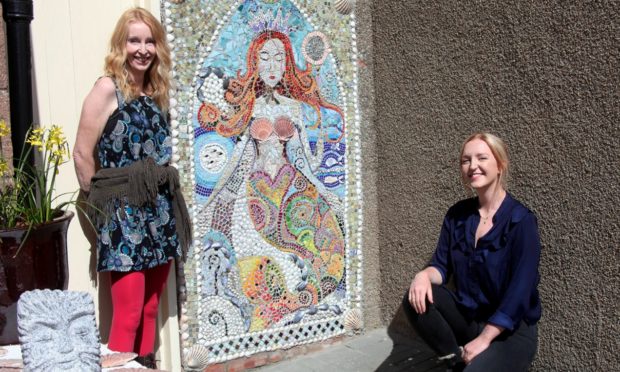 Jilly Henderson and Daisy Stott with their mosaic.
