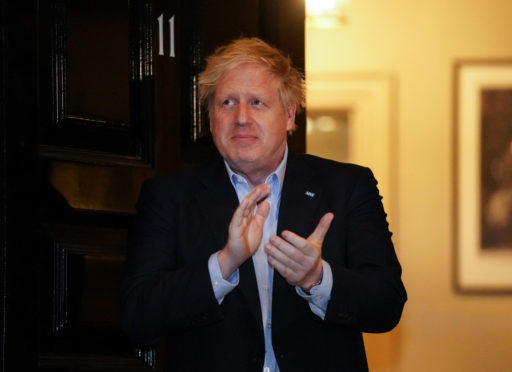 Prime Minister Boris Johnson takes part in the clap for the NHS gesture.
