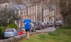 Stephen Coulter running through the streets of Murthly
