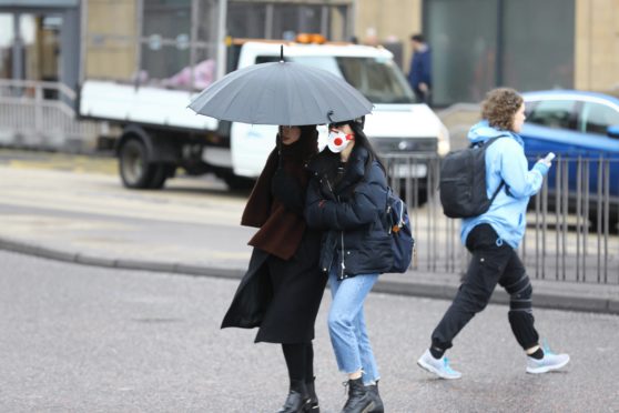 A woman wearing a face mask in Dundee