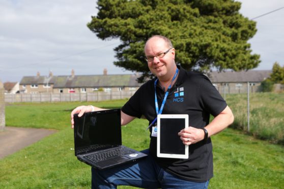 Malcolm Campbell with some of the equipment donated.