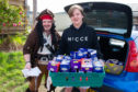 Richard Tart (aka Captain Jack Sparrow) and Lee Mills loading the Easter Eggs ready for distributing in the Linlathen.