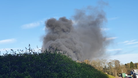 Smoke can be seen billowing from the fire.
