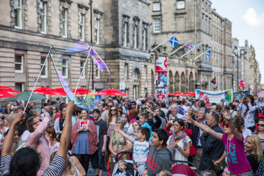 Crowds fill the Royal Mile.