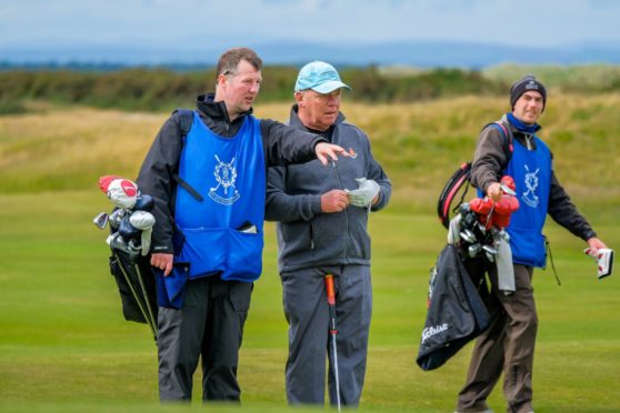 St Andrews Links caddie manager Fraser Riddler on the bag.