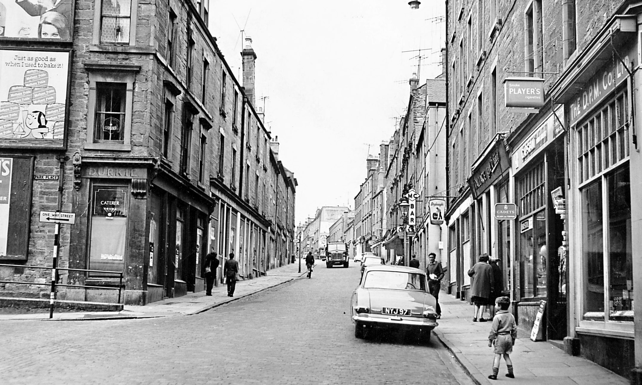 An old photograph looking upwards towards the Hawkhill Shops (Old Westport) from the bottom of Westport, Dundee.