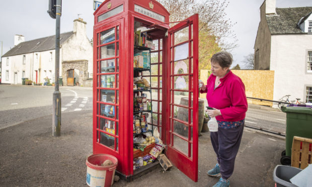Susan Crawford checks the community food larder in Muthill.