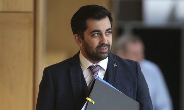 Justice Secretary Humza Yousaf arrives for the Covid-19 emergency legislation debate at the Scottish Parliament.