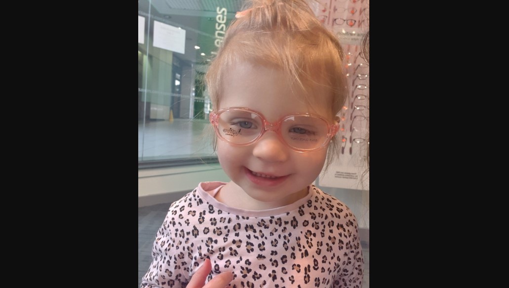 Isabella Payne trying on her new glasses.