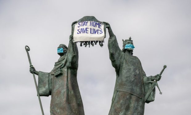 A lockdown message in support of the NHS decorates the Declaration of Independence monument in Arbroath.