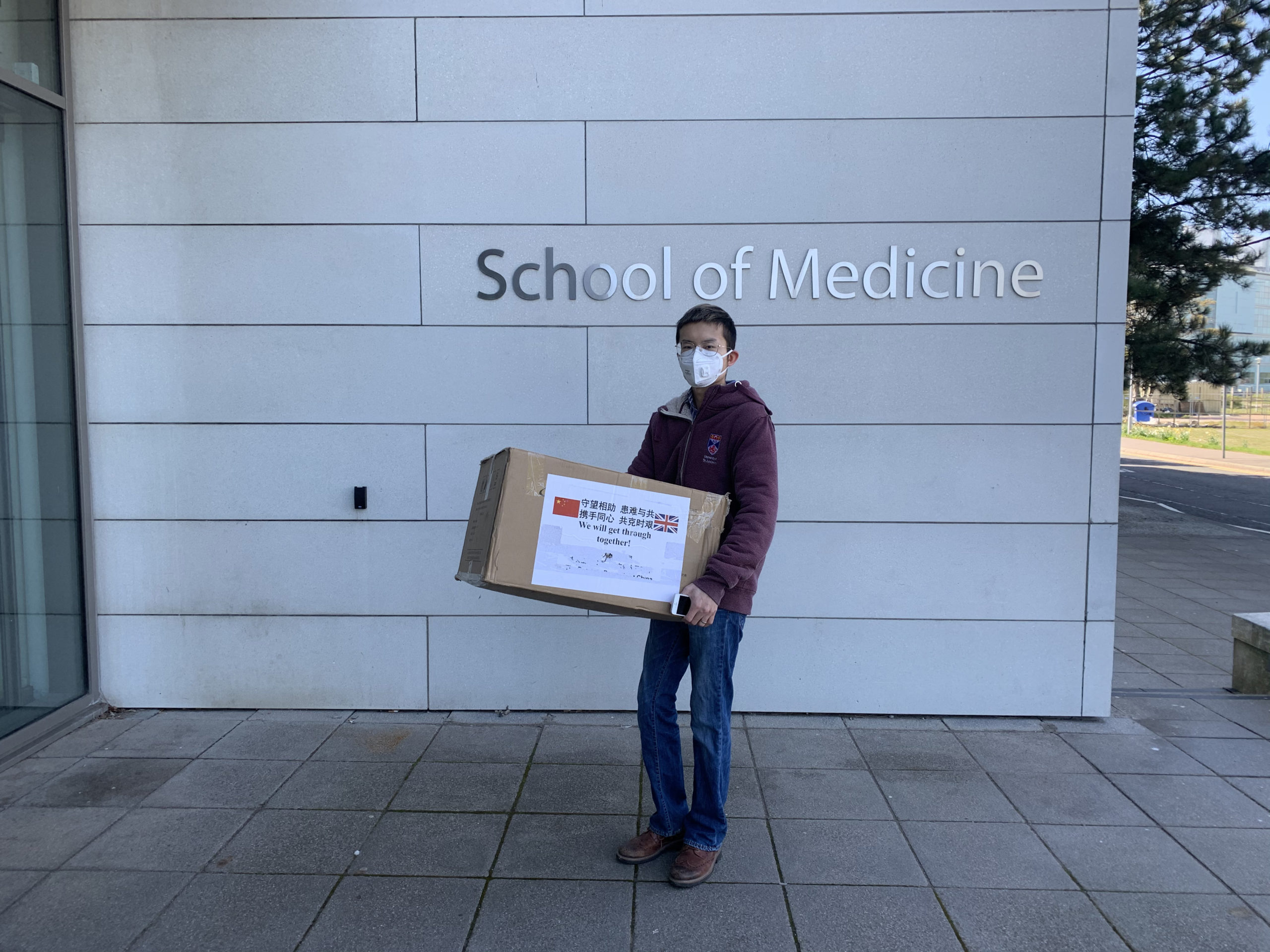 Student Liangfei Zhang dropping some of the equipment off at St Andrews School of Medicine.