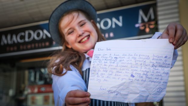 Caitlyn Yule, 10, with her letter asking to work at the butchers.