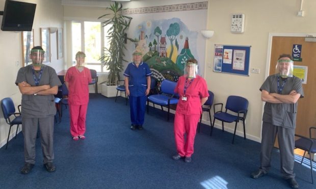 Staff at Princes Street Surgery in Dundee are using the face shield produced by NCR