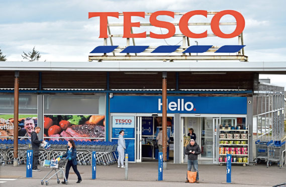 Pictured are shoppers queuing using social distancing at Tesco supermarket in Newtonhill during the Coronavirus Covid-19 outbreak.