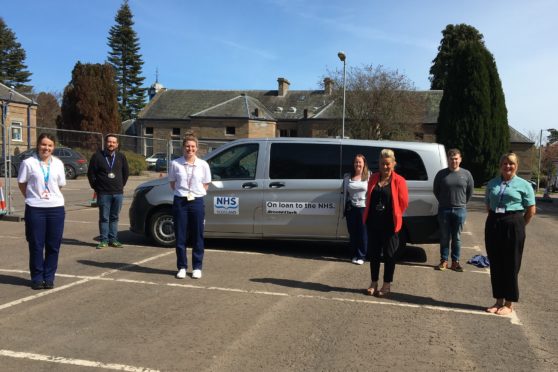 Staff from the transport hub with one of the donated vehicles