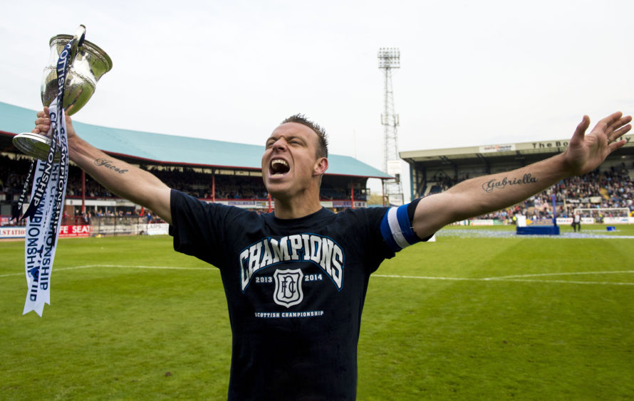 Dundee skipper Gavin Rae celebrates winning Championship