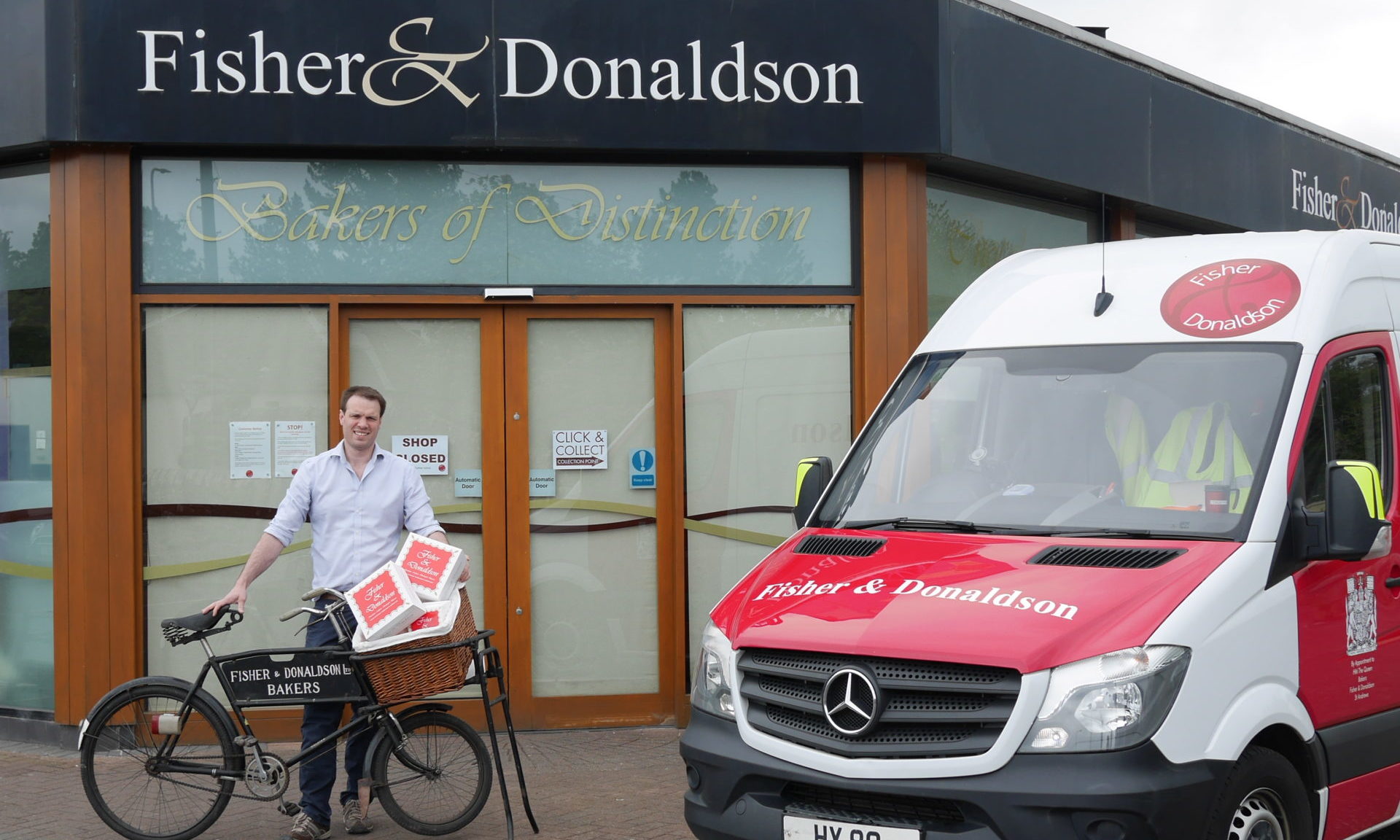 Ben Milne with his grandfather's bike at Fisher & Donaldson bakers in Cupar