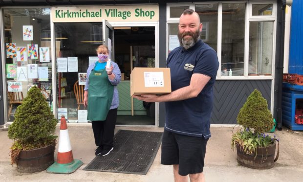 Blair Athol Distillery employees distribute free hand sanitiser to Kirkmichael Village Shop