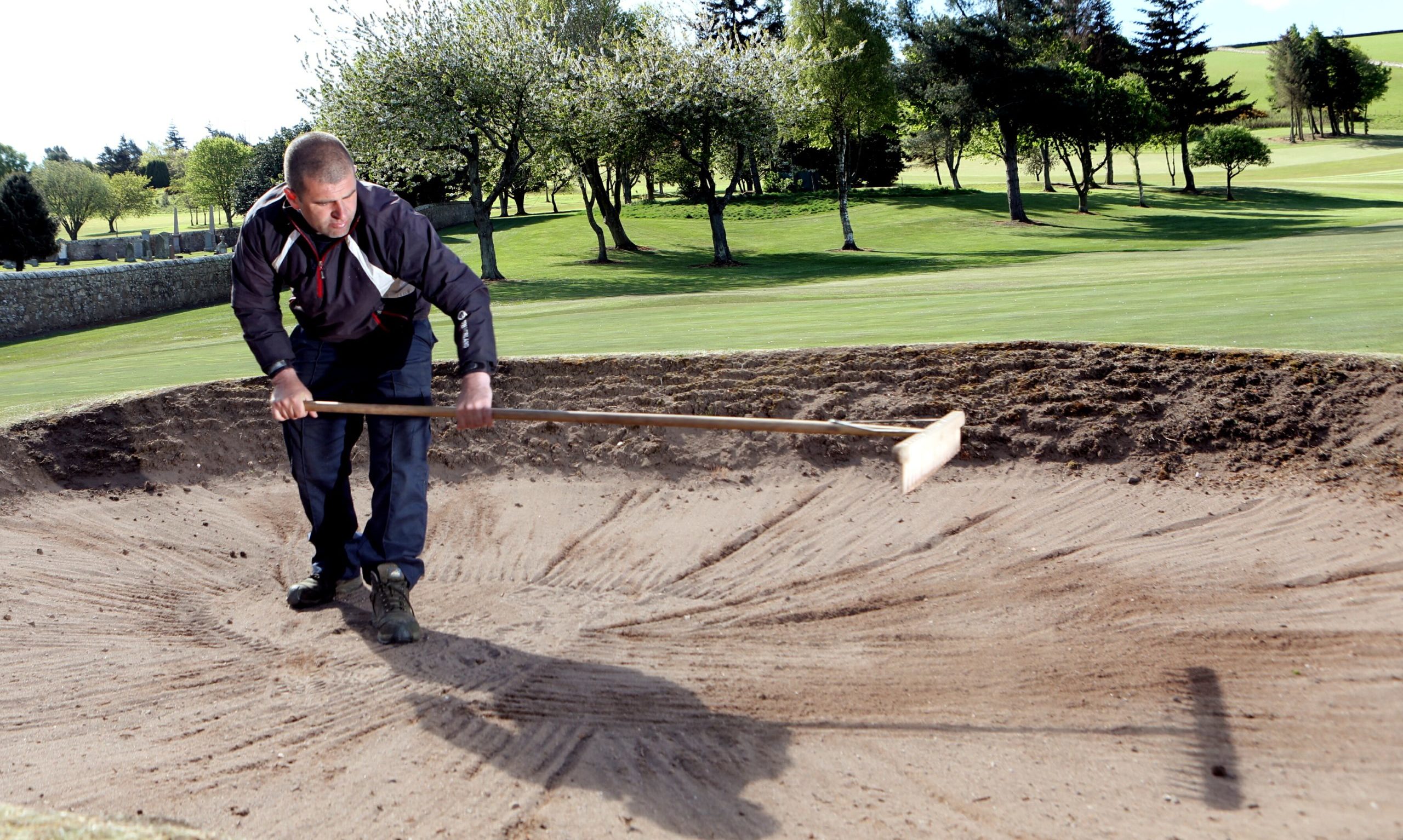 Cupar Golf Club head greenkeeper Gary Douglas hard at work
