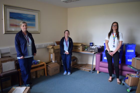 Photo Caption:-
Members of the new team redeployed to distribute ‘care boxes’ to hospital wards across Fife.