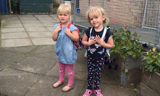 Cousins Merida Stephens and Sophia Goldie on their first day at Crossford Nursery.