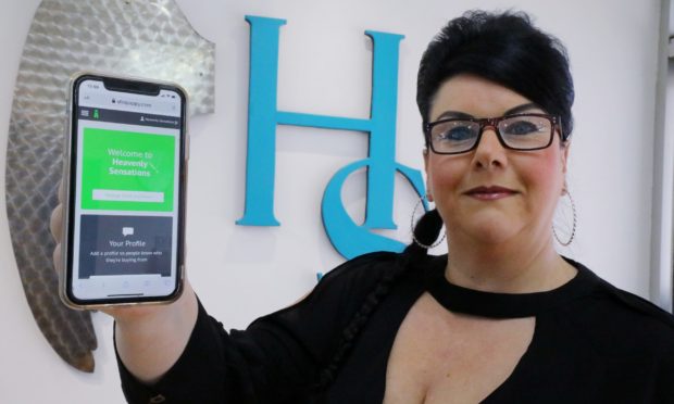 Amanda Allan from Heavenly Sensations salon demonstrates the app.