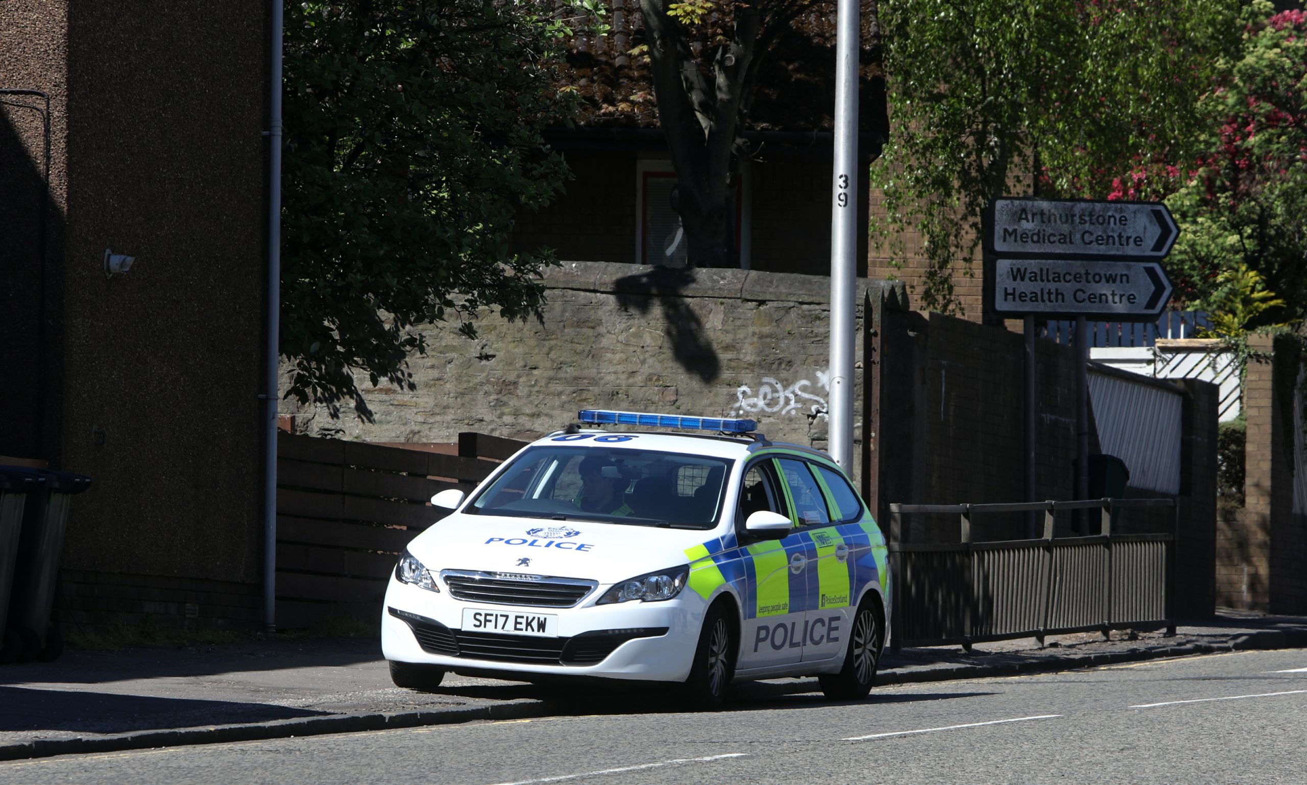 The police vehicle sitting on Dens Road in Dundee on May 6.