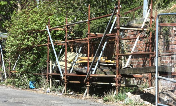 The rusty scaffolding behind the Tay Taxis office on Clepington Road in Dundee.