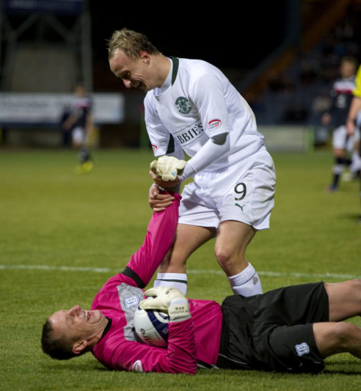 Griffiths - in action for Hibs against Dundee - jokes around with former team-mate Rab Douglas