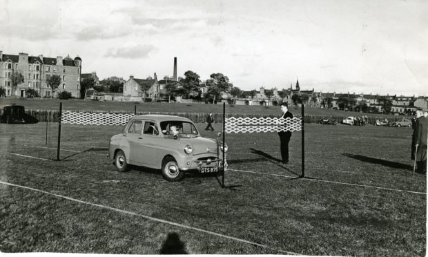 A car does a reversing test in a driving proficiency competition at Riverside Park, Dundee, in October 1959.