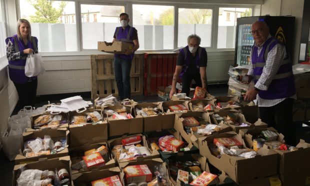 Angus Council leader David Fairweather with staff a one of the food hubs.