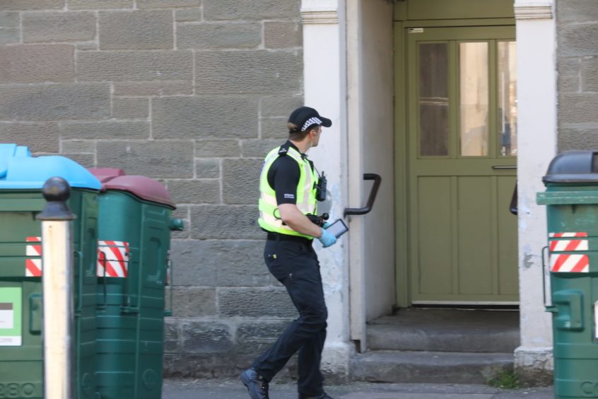 Police in Dundonald Street, Dundee.