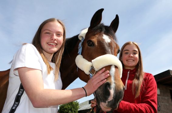 Rebekah Walker and Jessica Murray with Jessica's horse, Diva.