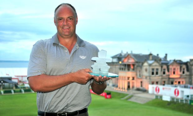 Graham Proctor, founder and CEO of St Andrews Legacy, overlooks the Old Course holding an Inukshuk, an Inuit symbol of unity and purpose, presented to him by Soldier On Canada at the launch of St Andrews Legacy in July 2013.