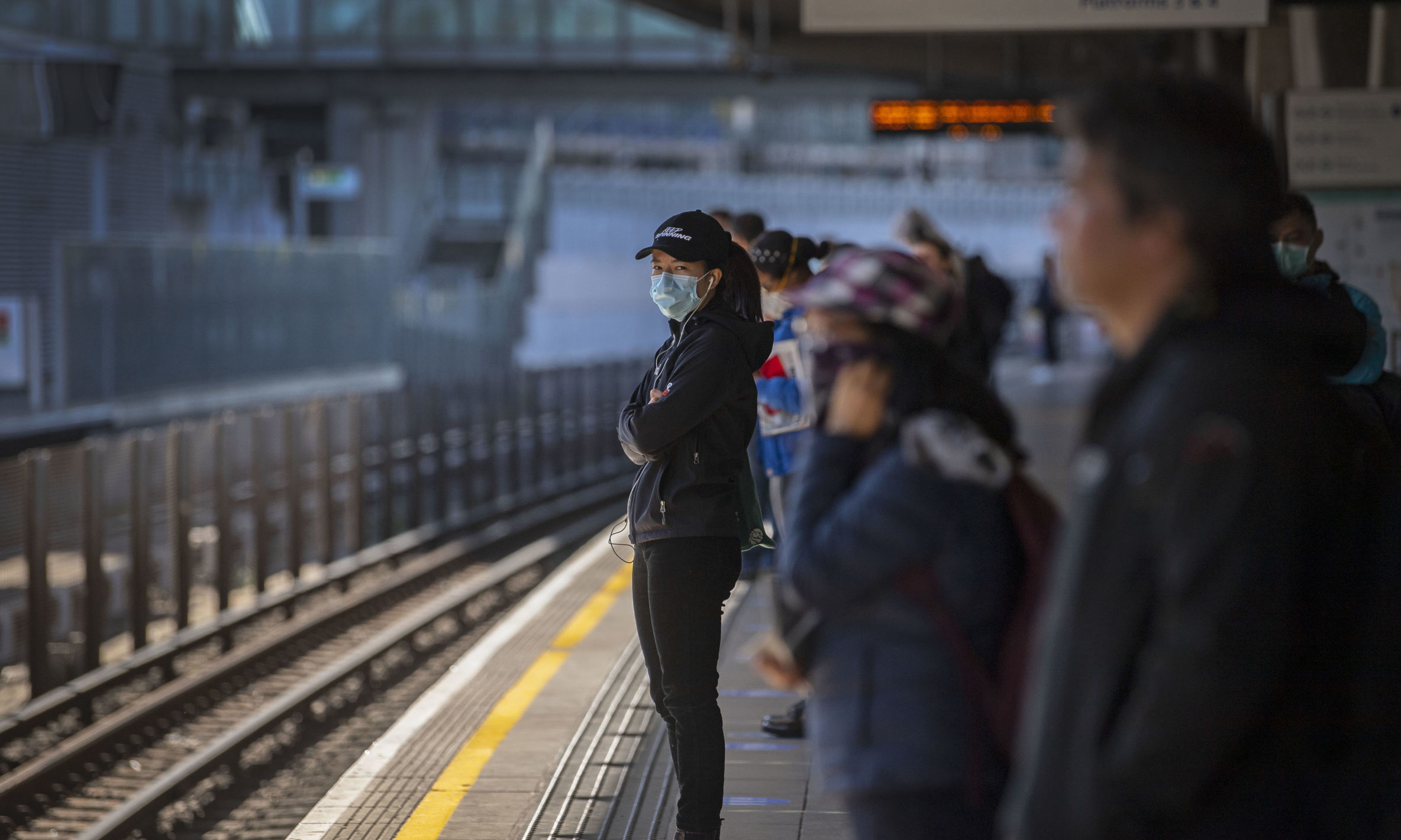 Passengers wearing face masks on a railway platform on May 12 during the lockdown.