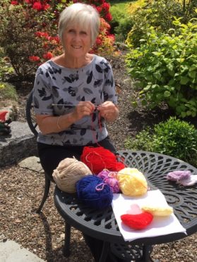 Beverley Horner knitting hearts.