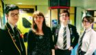 The photo shows John Hamilton, Blake McBride and Morgan Cameron of the steering group with Cara Spence in school at the end of last year.
