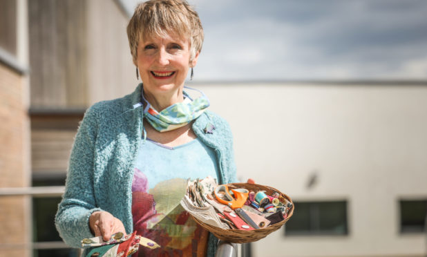 The Courier, CR0021319, News, Jamie Buchan story, Liz Barrett has been making special, decorative fasteners for nurses to help keep their facemasks on. Picture shows; Liz Barrett with some of her 'button bands' Tuesday 12th May 2020. Mhairi Edwards/DCT Media