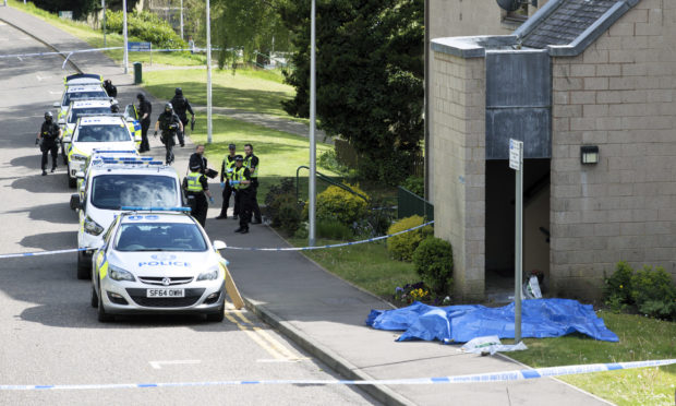 A trail of blood was visible leading out of the flats close area.