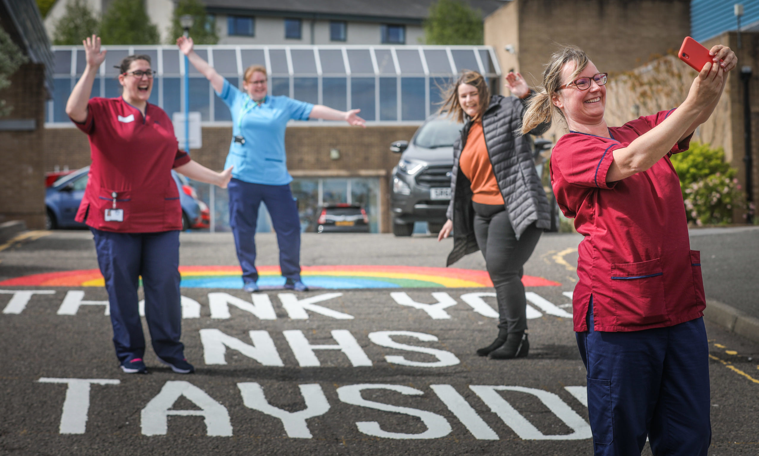 Staff take a photo with the new rainbow, left to right, Rachel Hunt, Senior Nurse, Pam Jaggard, Physio, Lynsey Laing of Wrightline Road Markings and front Gill Birrell, Senior Nurse. Tuesday 12th May, 2020.  Mhairi Edwards/DCT Media