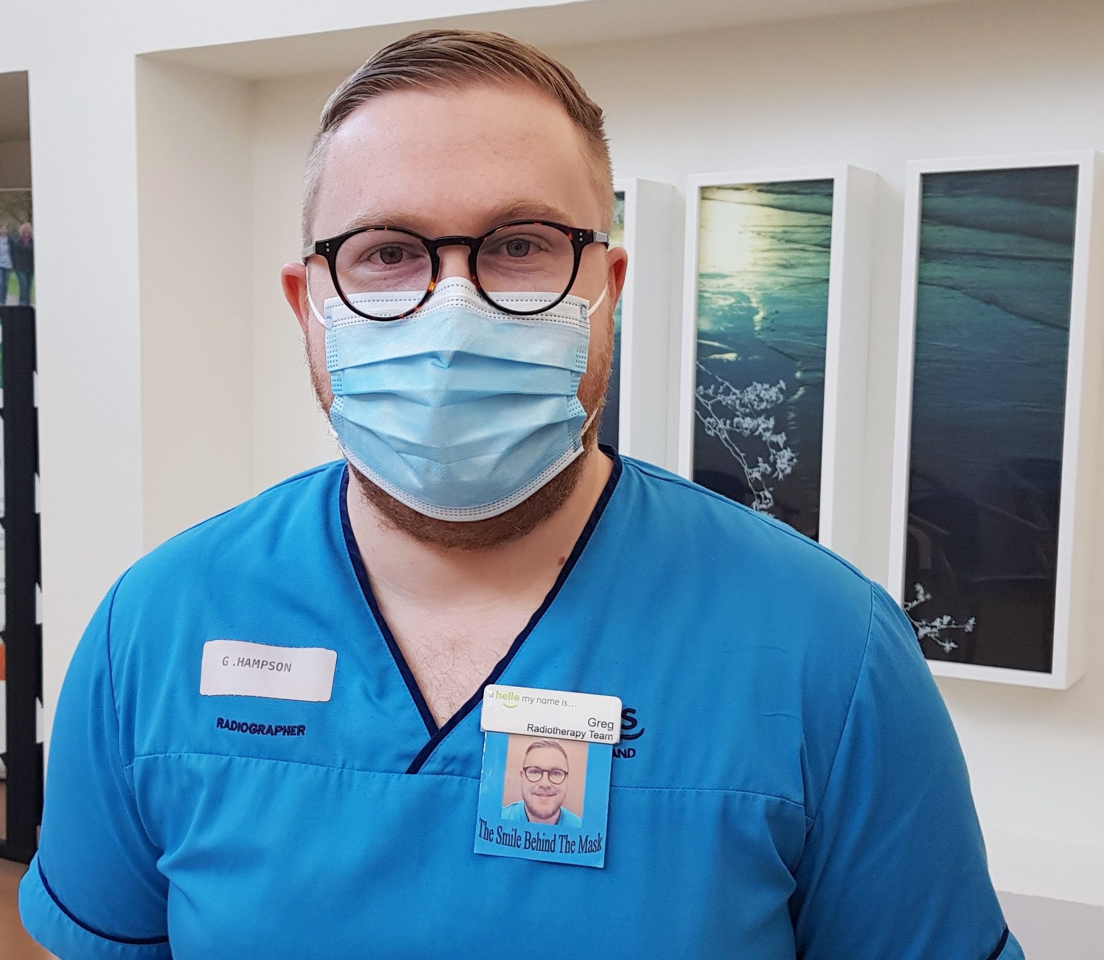 Therapeutic radiographer Greg Hampson wearing the smile behind the mask badge.