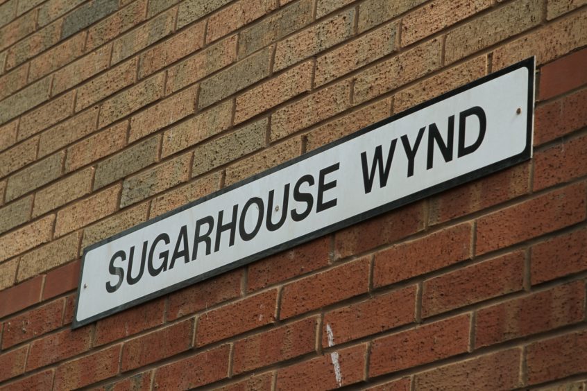 A sign that reads Sugarhouse Wynd. 