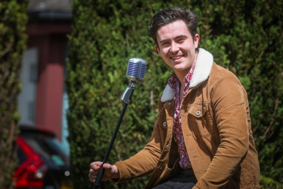 Singer and musician Finlay McKillop, 21, entertained residents with a garden gig.