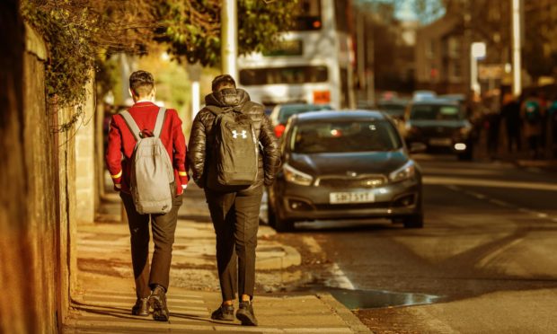 Pupils leave a local school at the beginning of the coronavirus pandemic.