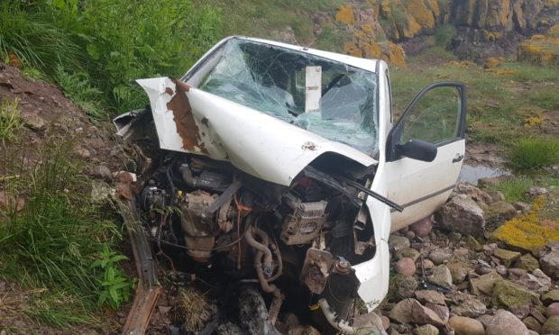 The wrecked van at the base of the Todhead cliff.