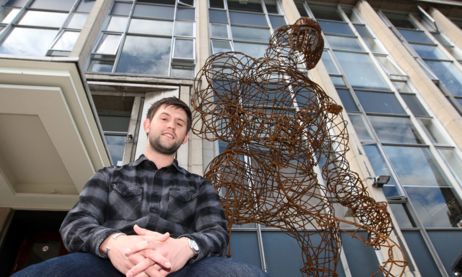 Duncan of Jordanstone, Dundee. Student Stuart Turnbull with his sculpture 'The Welder'.