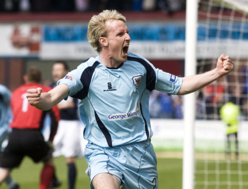 Gary Irvine celebrates a St Johnstone goal at Dens Park.