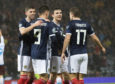 Dundee United's Lawrence Shankland celebrates his goal against San Marino with Scotland teammates Ryan Christie (left), Andy Robertson and James Forrest (right).